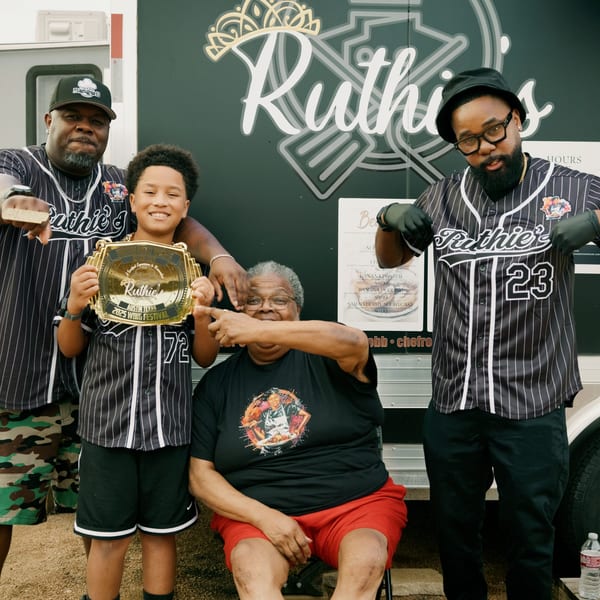 Three generations of the Ruthie's family proudly display their 2023 Wing Festival award.