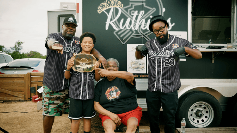 Three generations of the Ruthie's family proudly display their 2023 Wing Festival award.